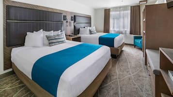 Ropa de cama hipoalergénica y tabla de planchar con plancha