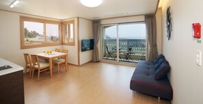 Panorama (Separate Bedroom) | Living area | 42-inch flat-screen TV with cable channels, TV, heated floors - The Ocean Hill (Seogwipo)