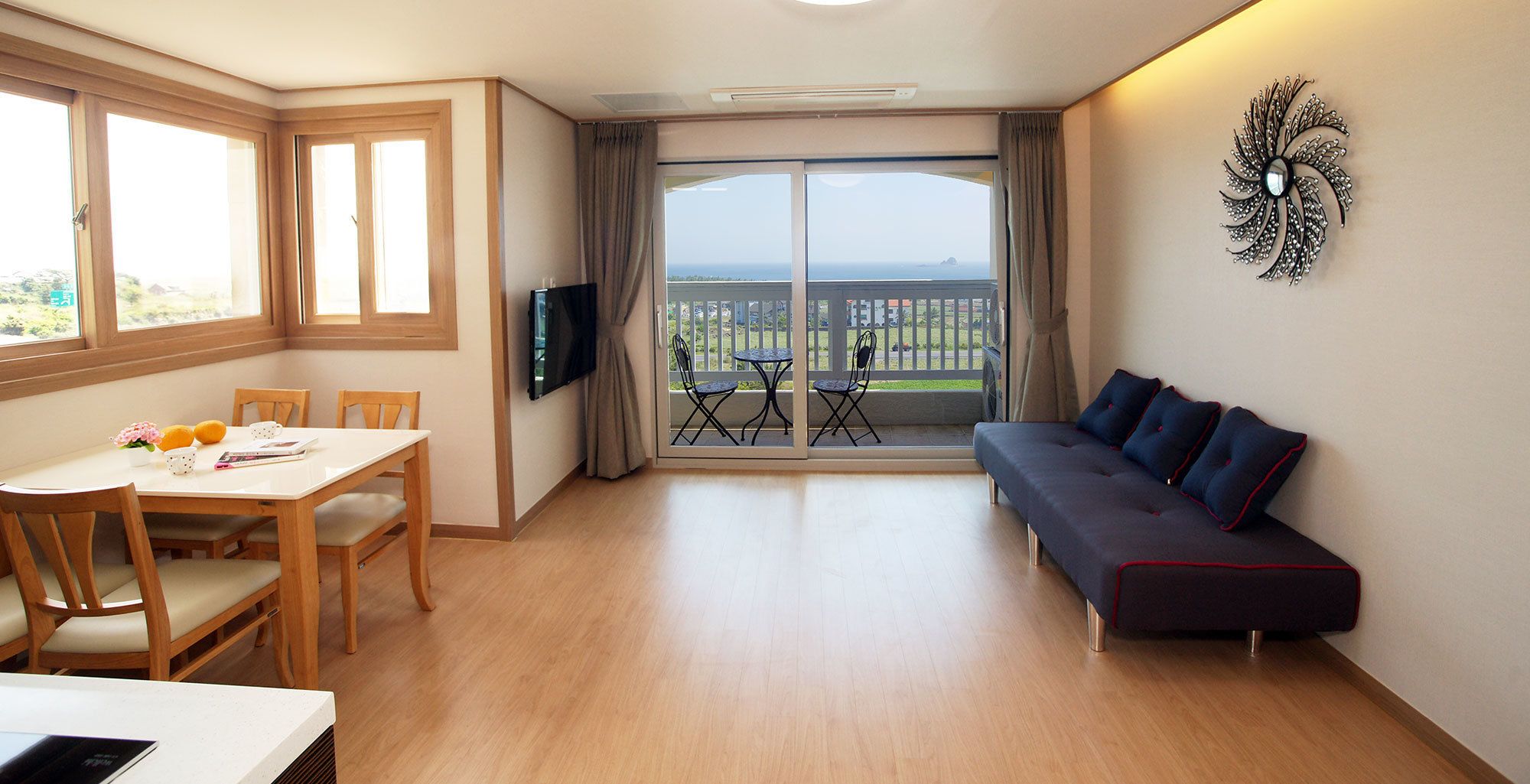 panorama (separate bedroom) | living area | 42-inch flat-screen tv with cable channels, tv, heated floors