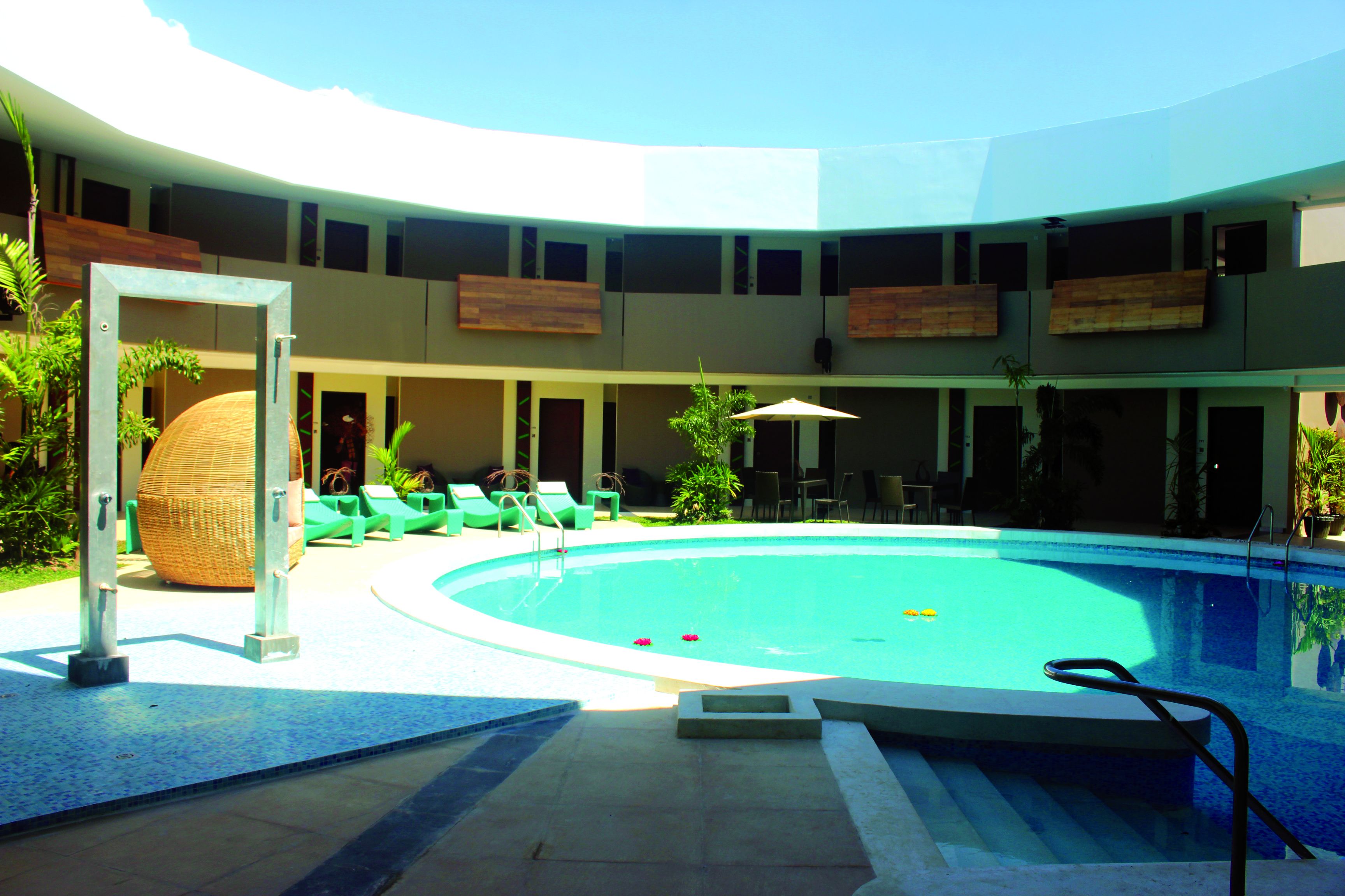 Outdoor pool, open 7:00 AM to 10:00 PM, pool loungers