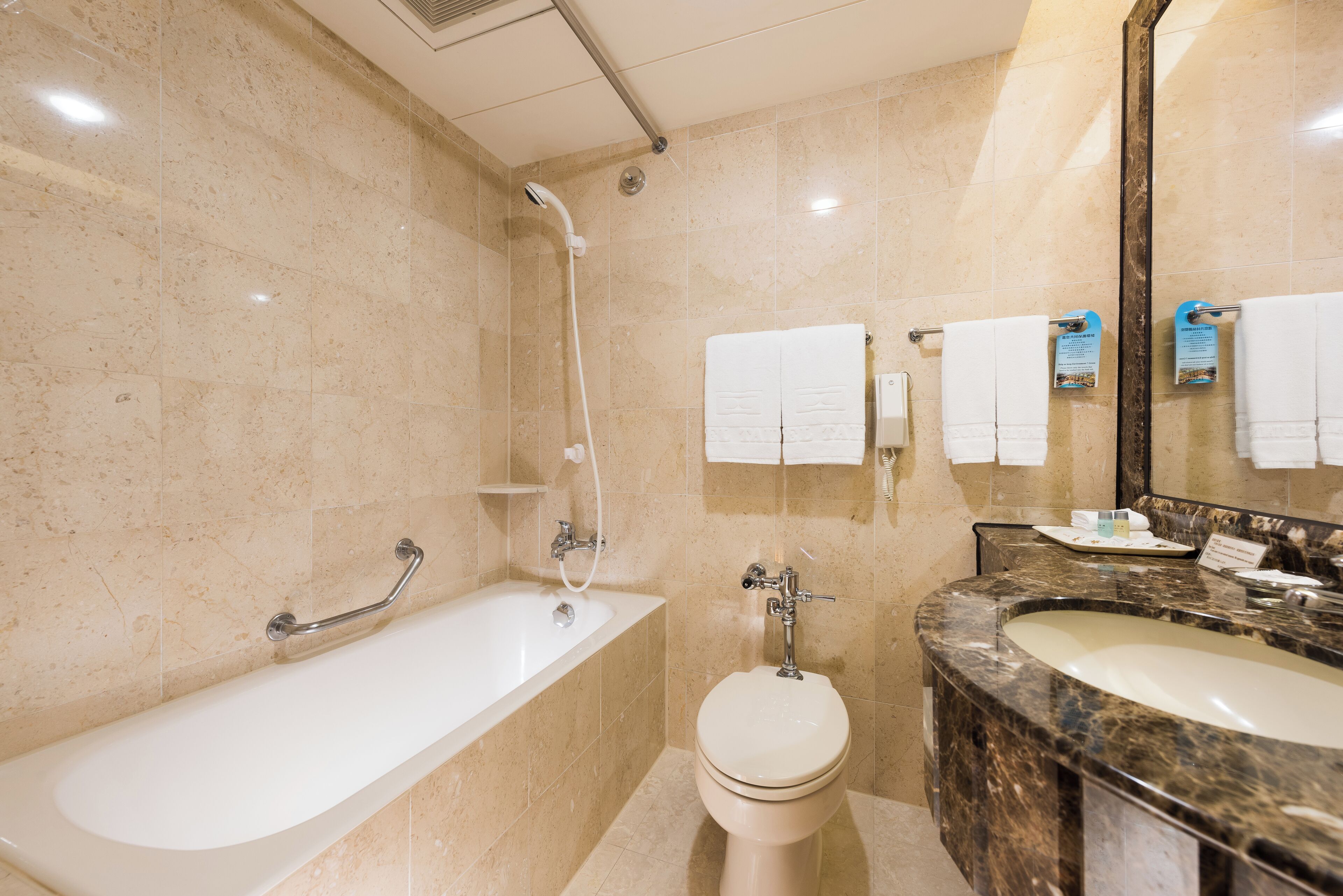 combined shower/bathtub, deep-soaking bathtub, hair dryer, slippers