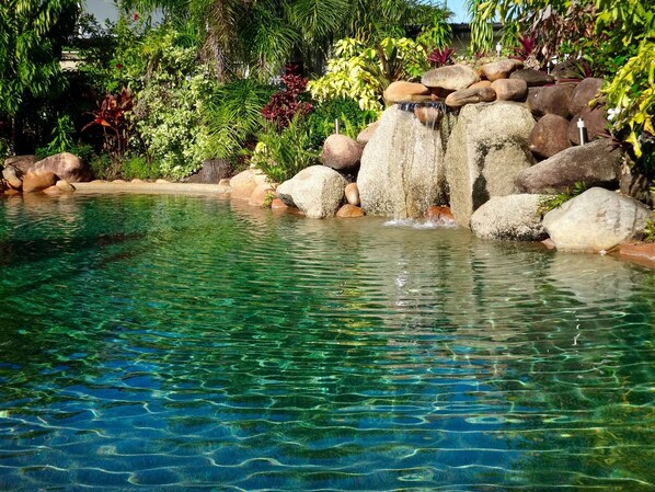 Outdoor pool, open 7 AM to 9 PM, pool loungers