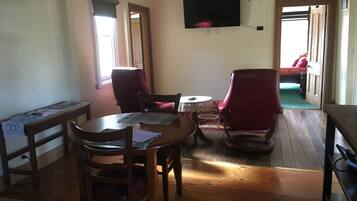 Sir John Cottage | Living area | Flat-screen TV, fireplace