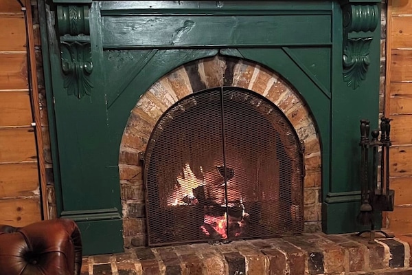 The Police Superintendents Cottage | Living area | Flat-screen TV, fireplace