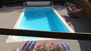 Seasonal outdoor pool, pool umbrellas, pool loungers