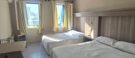 Basic Quadruple Room | Minibar, desk, laptop workspace, WiFi (free)
