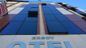 The exterior of the Erysoy Hotel with a modern design, featuring large windows and a prominent sign. - Ersoy Aga Otel (Antalya)