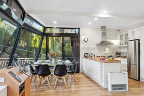 Boats and Bedzzz - Moving Waters Houseboat (Moored Accommodation) | Living area | 65-inch Smart TV with digital channels, TV, books - Boats And Bedzzz & Renmark River Villas (Renmark)