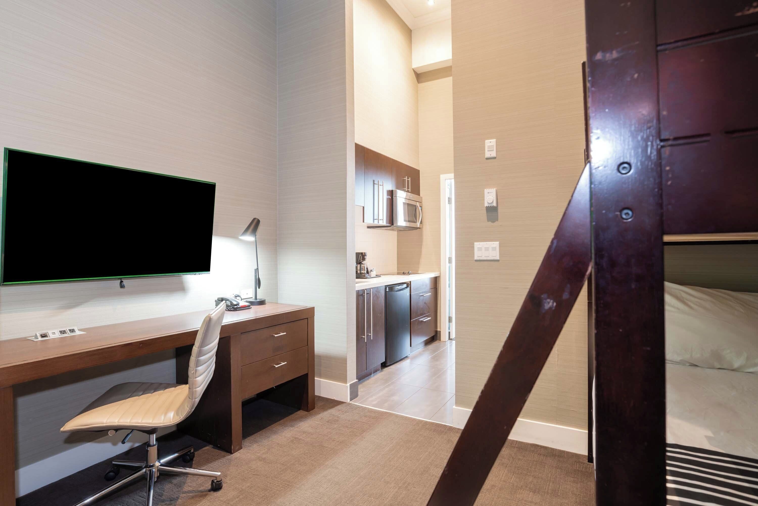 family suite, kitchenette (1 king bed, bunk beds) | in-room safe, blackout curtains, iron/ironing board, free wifi