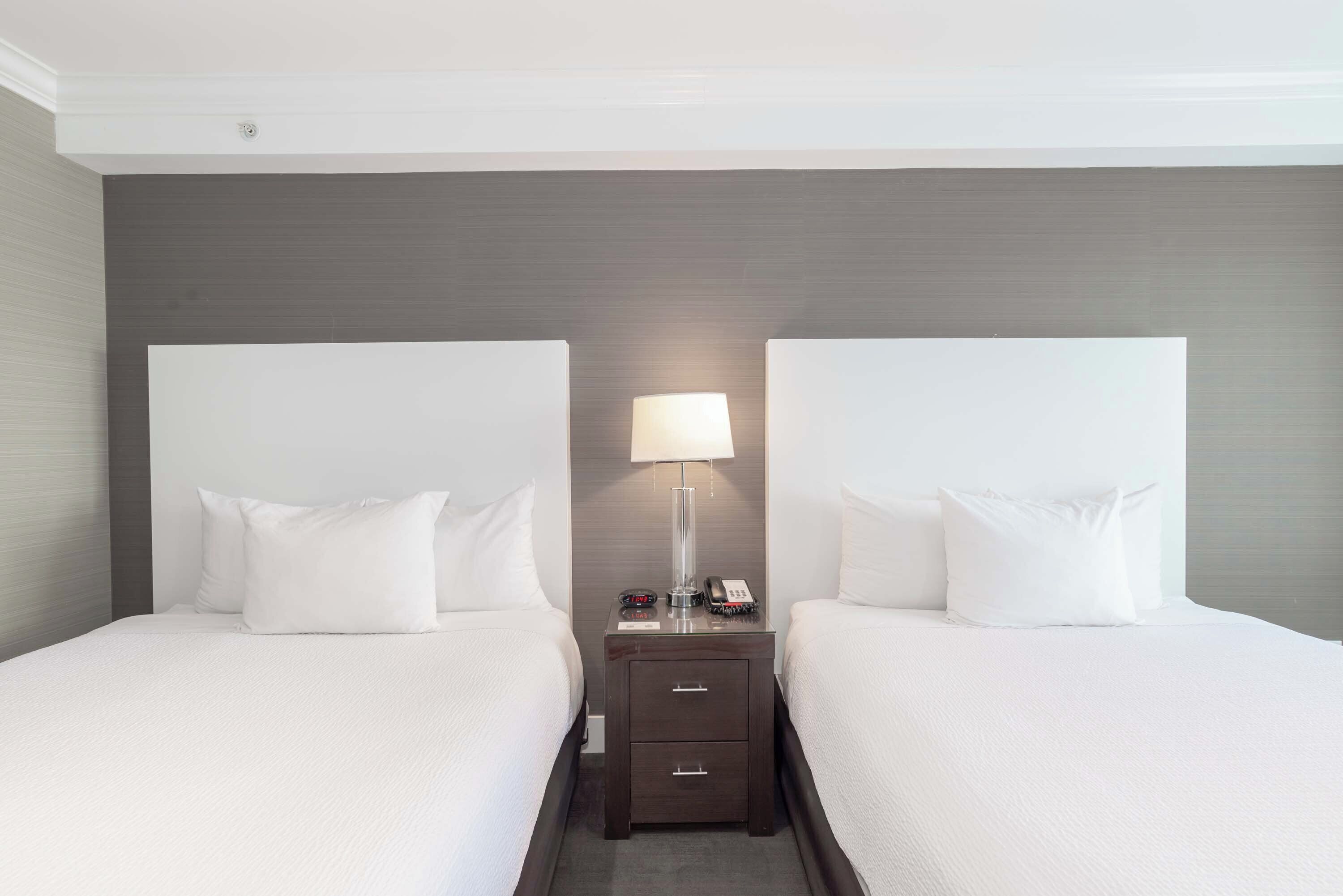 standard room, 2 queen beds | in-room safe, blackout curtains, iron/ironing board, free wifi