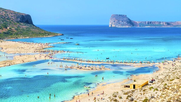 A coastal beach scene with clear blue waters, sandy shores, and rocky cliffs. - Cretan Mansion with Heated Swimming Pool (Apokoronas)
