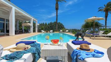 Outdoor pool, pool umbrellas, pool loungers