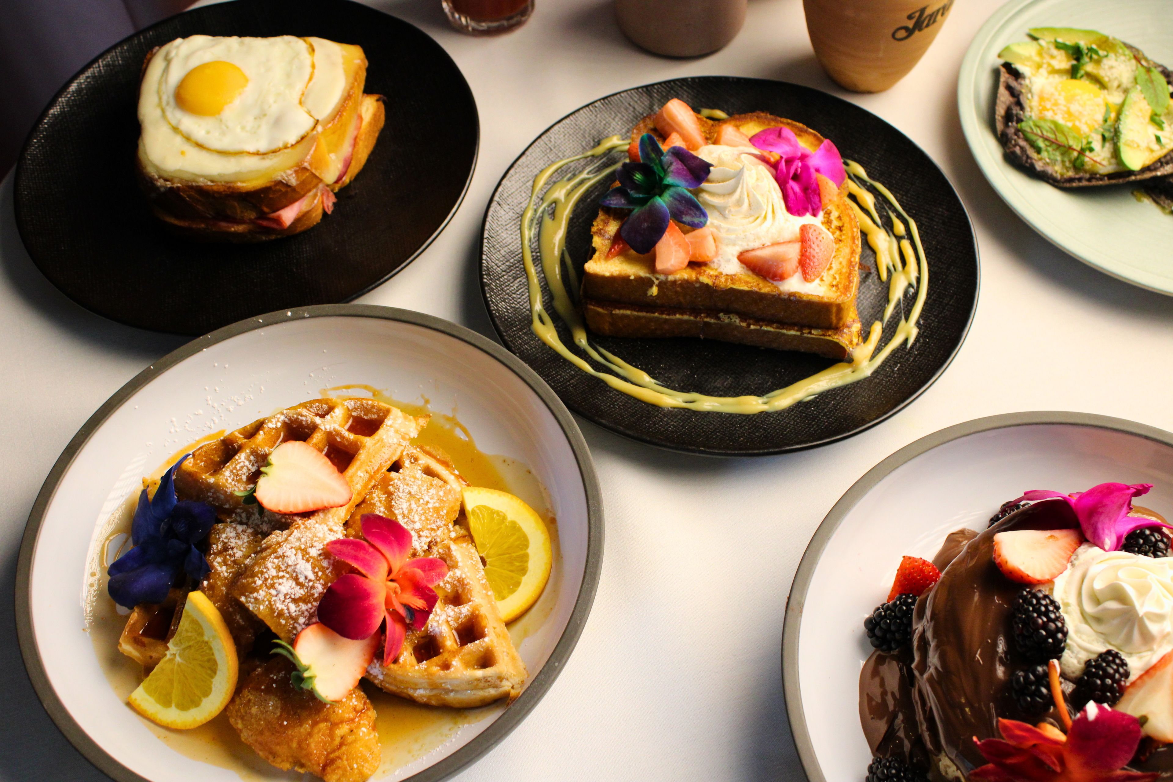 A variety of breakfast dishes on plates.
