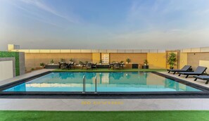 Outdoor pool, open 7:00 AM to 7:00 PM, sun loungers