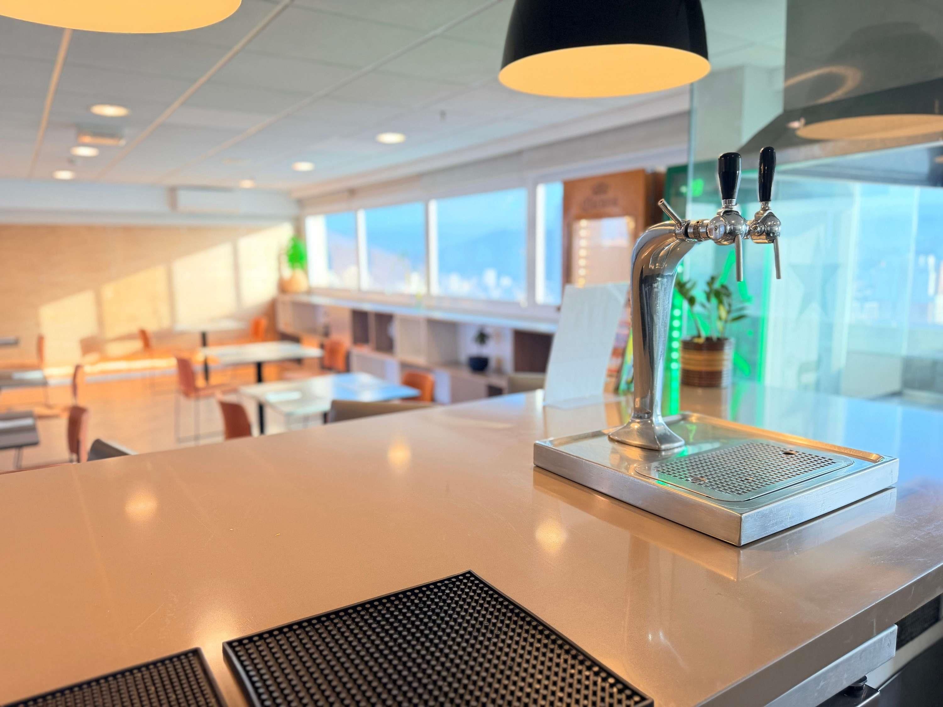 A modern bar area with a tap and a speaker system.