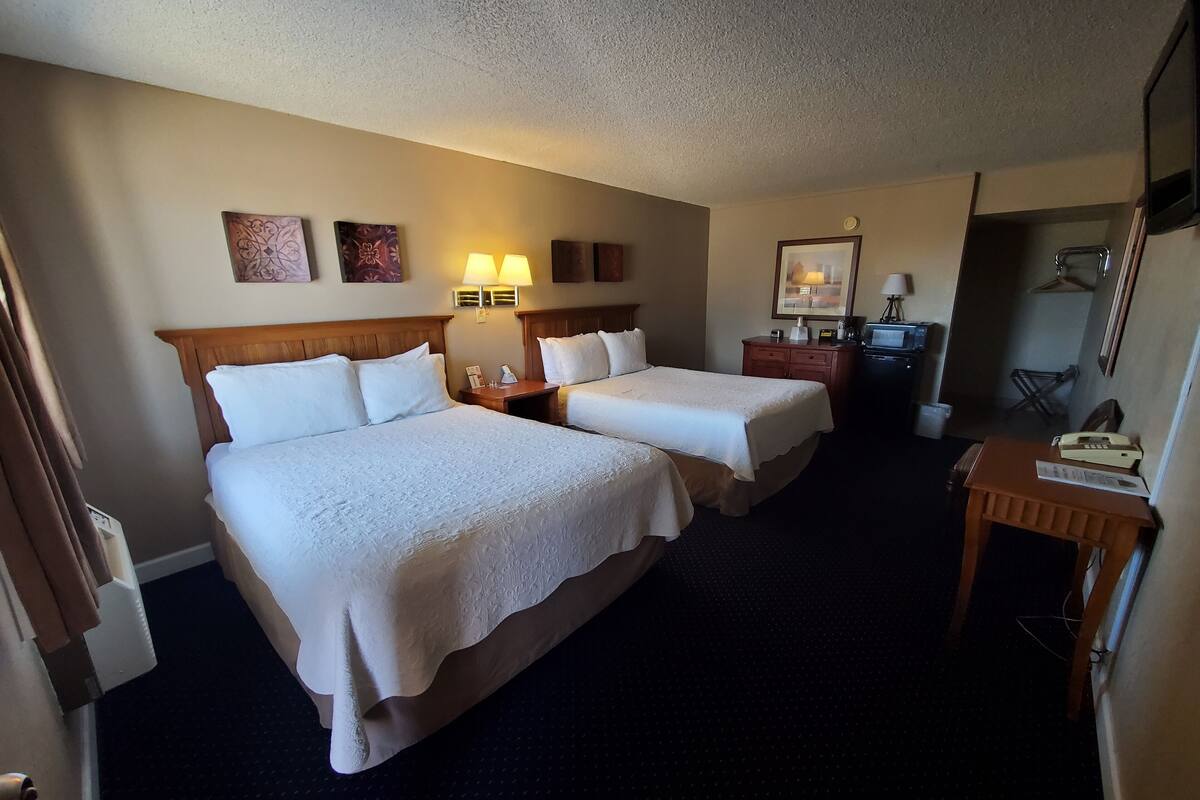 economy double room, 2 queen beds, non smoking | 1 bedroom, desk, iron/ironing board, free wifi