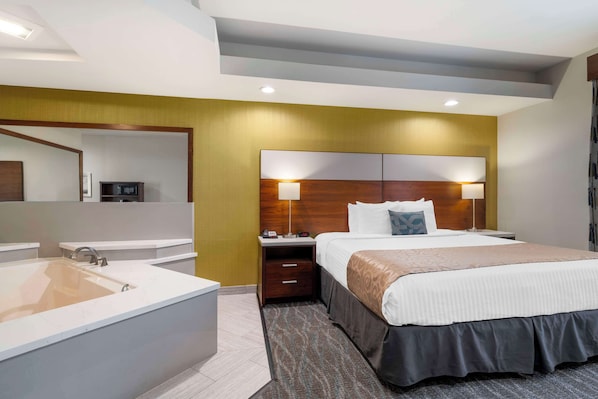 Chambre Standard, 1 très grand lit, non-fumeurs, baignoire à jets | Surmatelas, coffres-forts dans les chambres, bureau