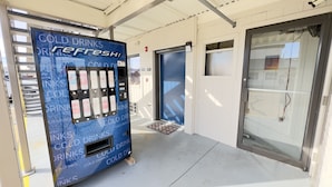 A vending machine labeled 'COLD DRINKS REFRESH' with a variety of beverage options. - Motel 6 Dyersburg, TN (Dyersburg)