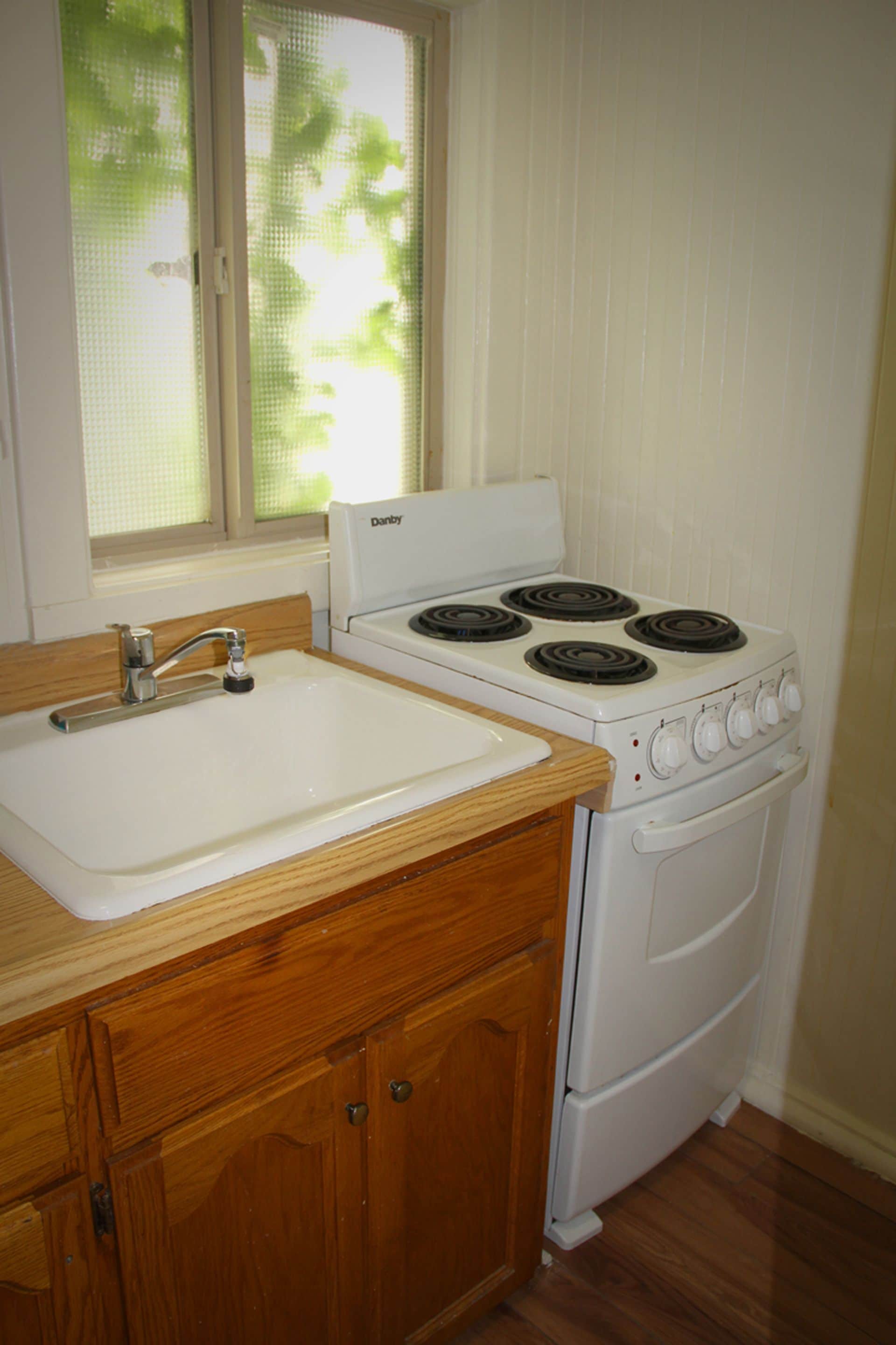 family cottage, 1 queen bed, non smoking (4, 6, 7, or 8) | private kitchen | fridge, microwave, coffee/tea maker