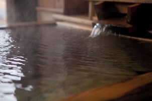 A reflective surface with a blurred background.