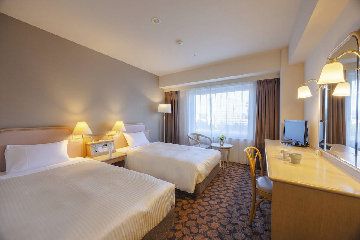 Premium bedding, down comforters, desk, laptop workspace