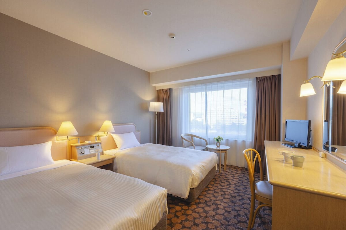 Premium bedding, down comforters, desk, laptop workspace