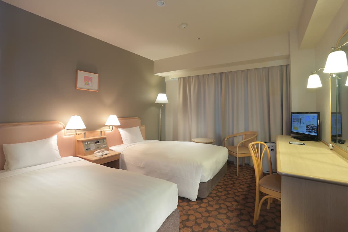 Premium bedding, down duvets, desk, laptop workspace