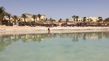 Private beach, white sand, sun-loungers, beach umbrellas