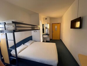 A bunk bed room with a single bed, a small desk, a mirror, and a television on the wall. - Hotel Villenouvelle (Montauban)