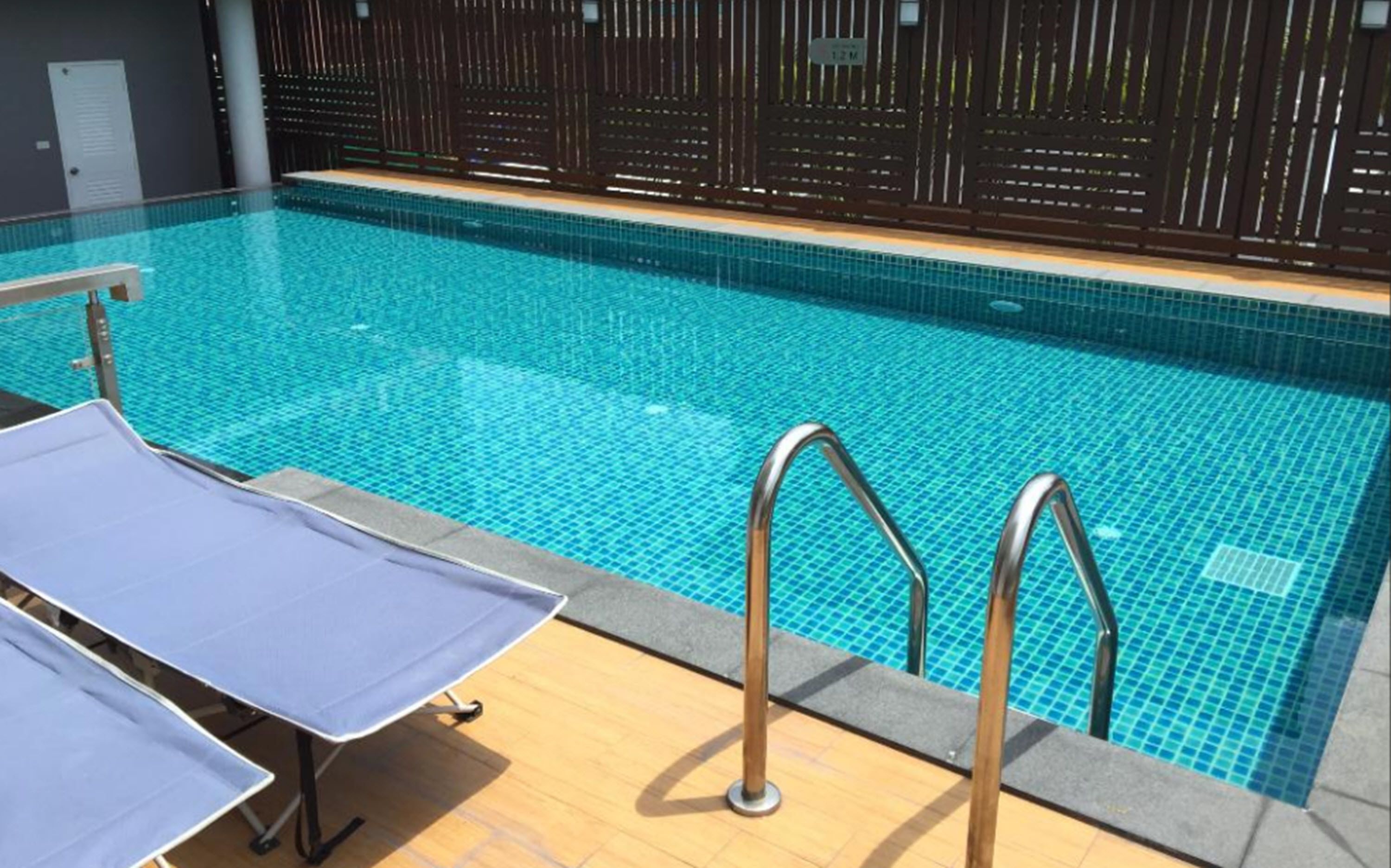 outdoor pool, pool umbrellas, pool loungers