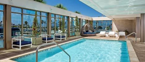 Outdoor pool, open 7:00 AM to 10:00 PM, sun loungers