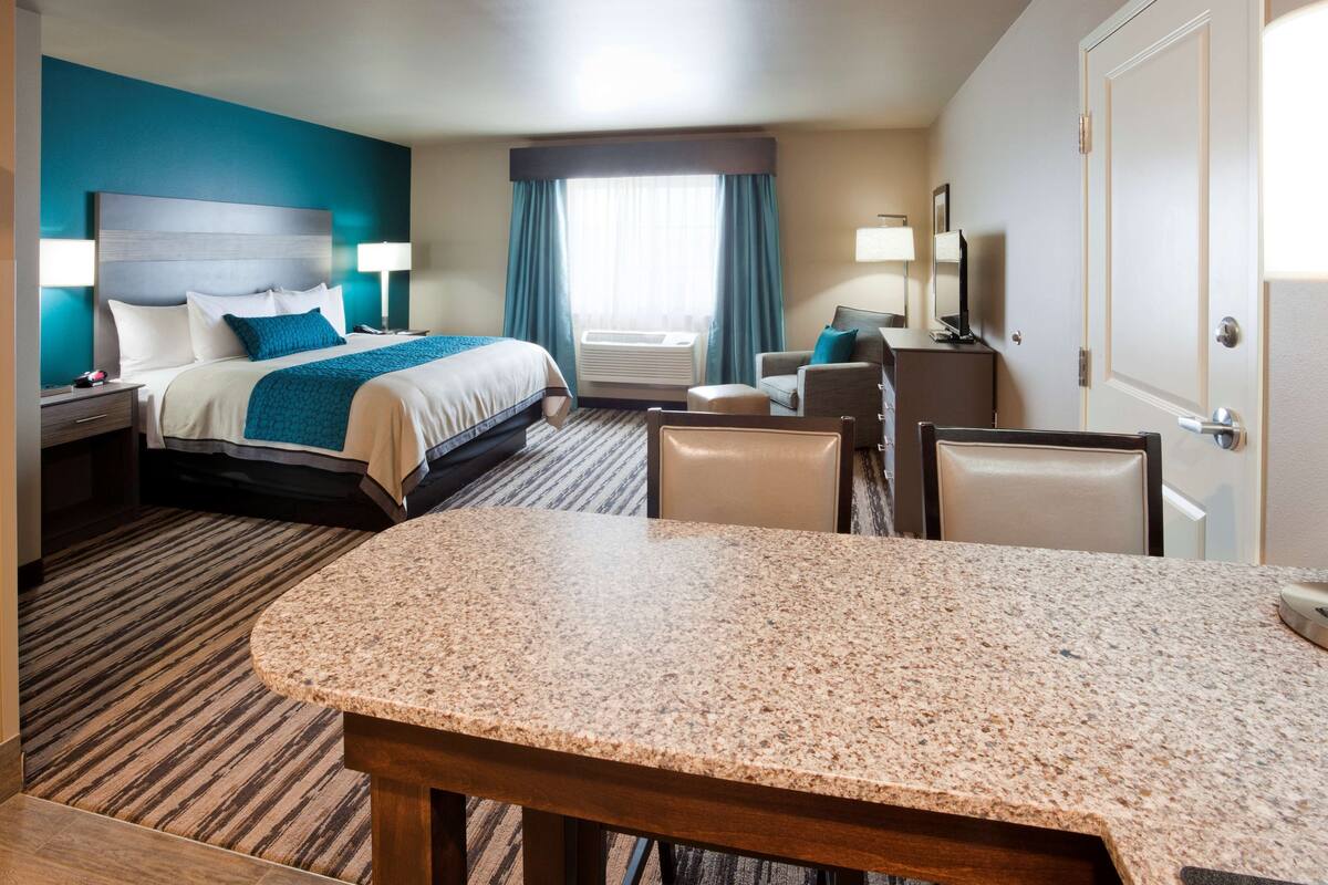 king junior suite disability access | premium bedding, desk, laptop workspace, blackout curtains