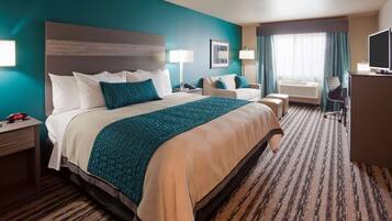 Premium bedding, desk, laptop workspace, blackout curtains