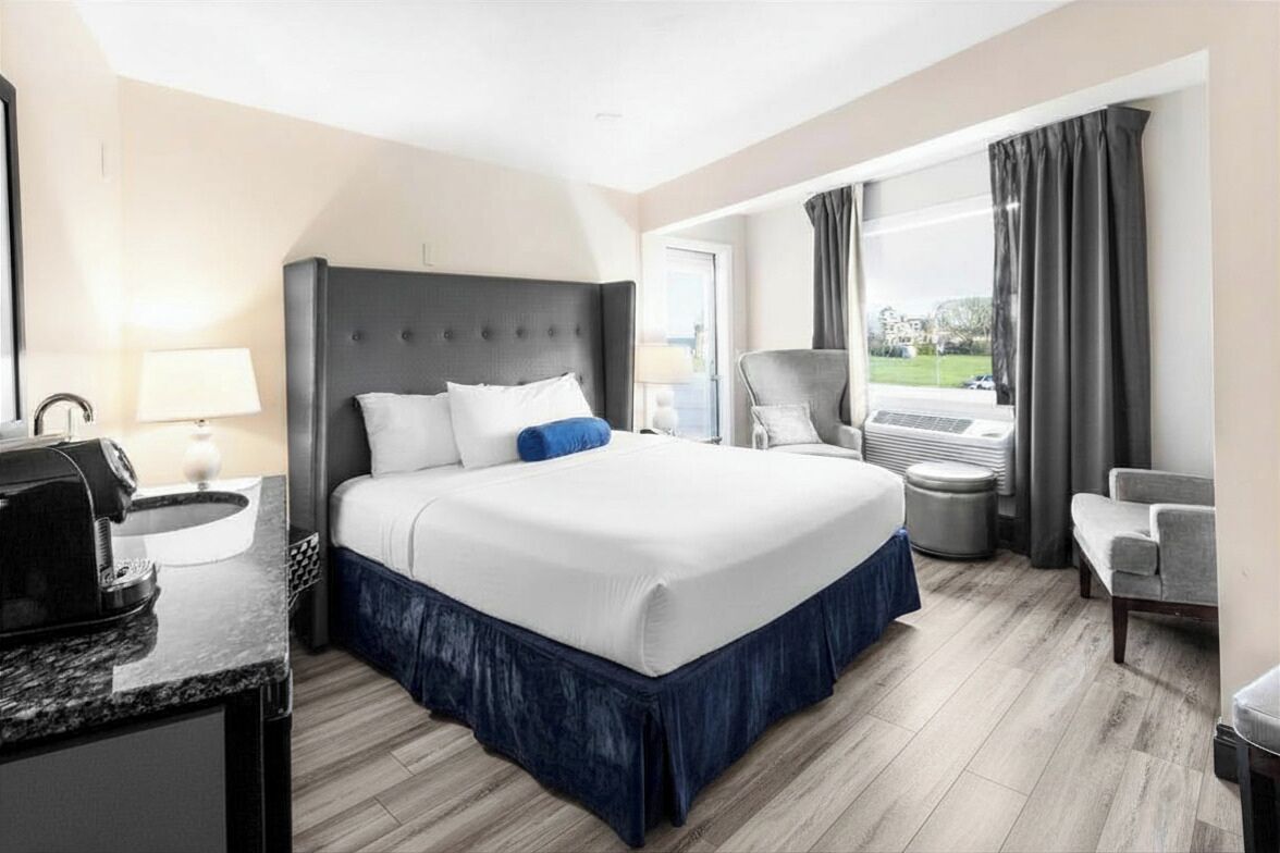 The Blue | Premium bedding, laptop workspace, blackout curtains, iron/ironing board