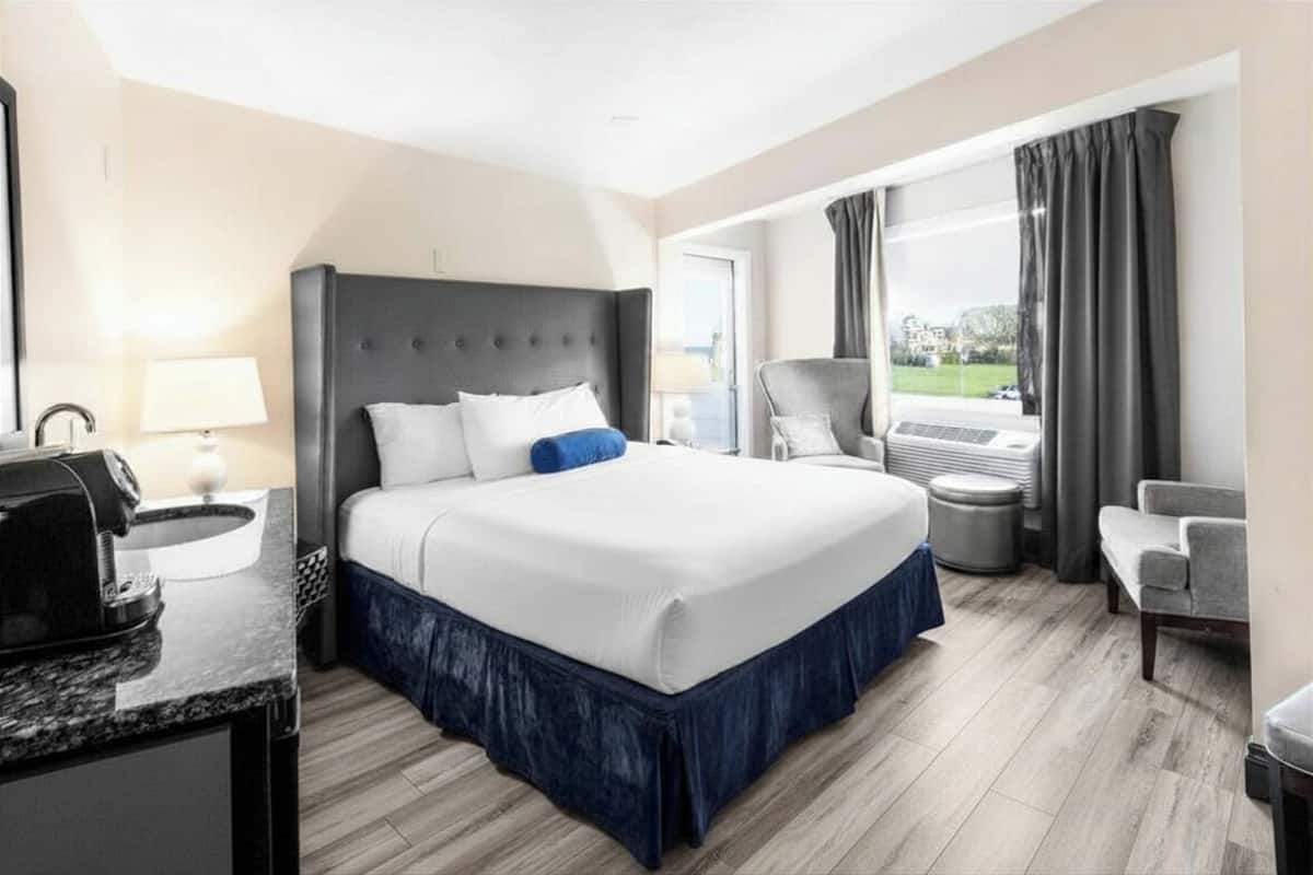 The Blue | Premium bedding, laptop workspace, blackout drapes, iron/ironing board