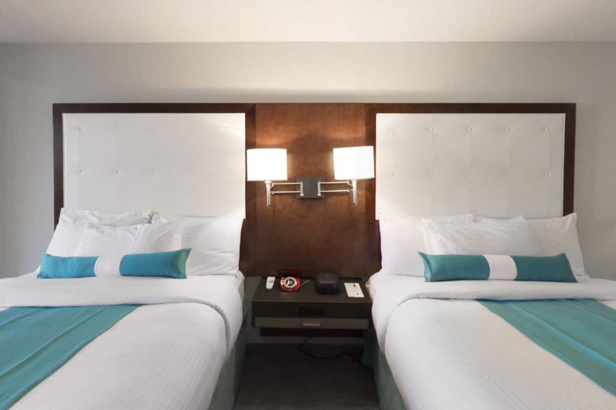 The Aqua | Premium bedding, laptop workspace, blackout curtains, iron/ironing board