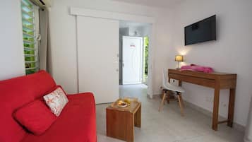 Premium Suite, 1 Bedroom, Hot Tub (Suite Feu: Passion) | Living area | 32-inch flat-screen TV with satellite channels, TV, Netflix