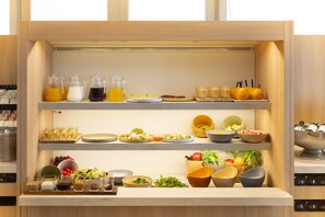A buffet setup with various food items and beverages. - Richmond Hotel Namba Daikokucho (Osaka)