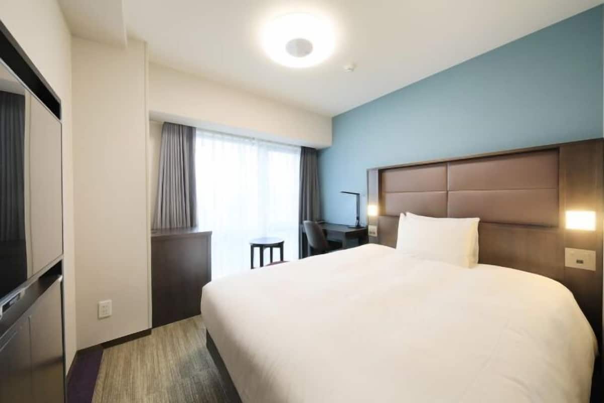 Desk, laptop workspace, blackout curtains, free WiFi
