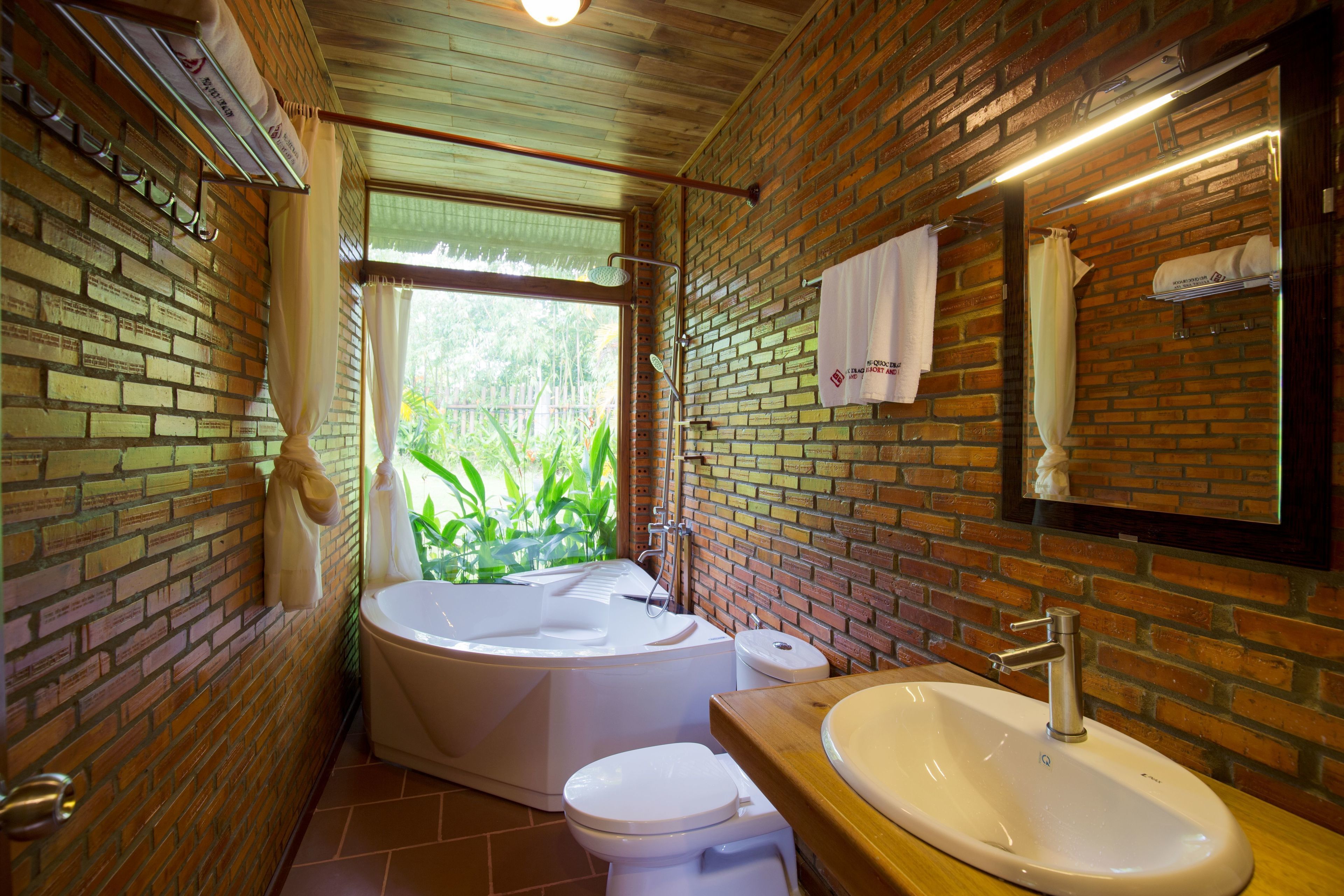 bungalow, pool view | bathroom | free toiletries, hair dryer, slippers, towels