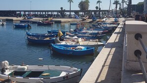 A marina with multiple boats docked along the waterfront. - Airport Rooms Bari  (Bari)