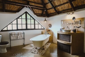 Tanzania Suite | Premium bedding, in-room safe, individually decorated - Amanzi Lodge (Harare)
