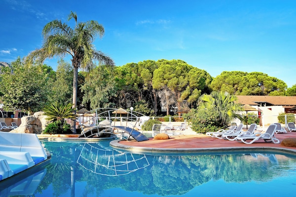Outdoor pool, a heated pool, open 9:00 AM to 8:00 PM, sun loungers