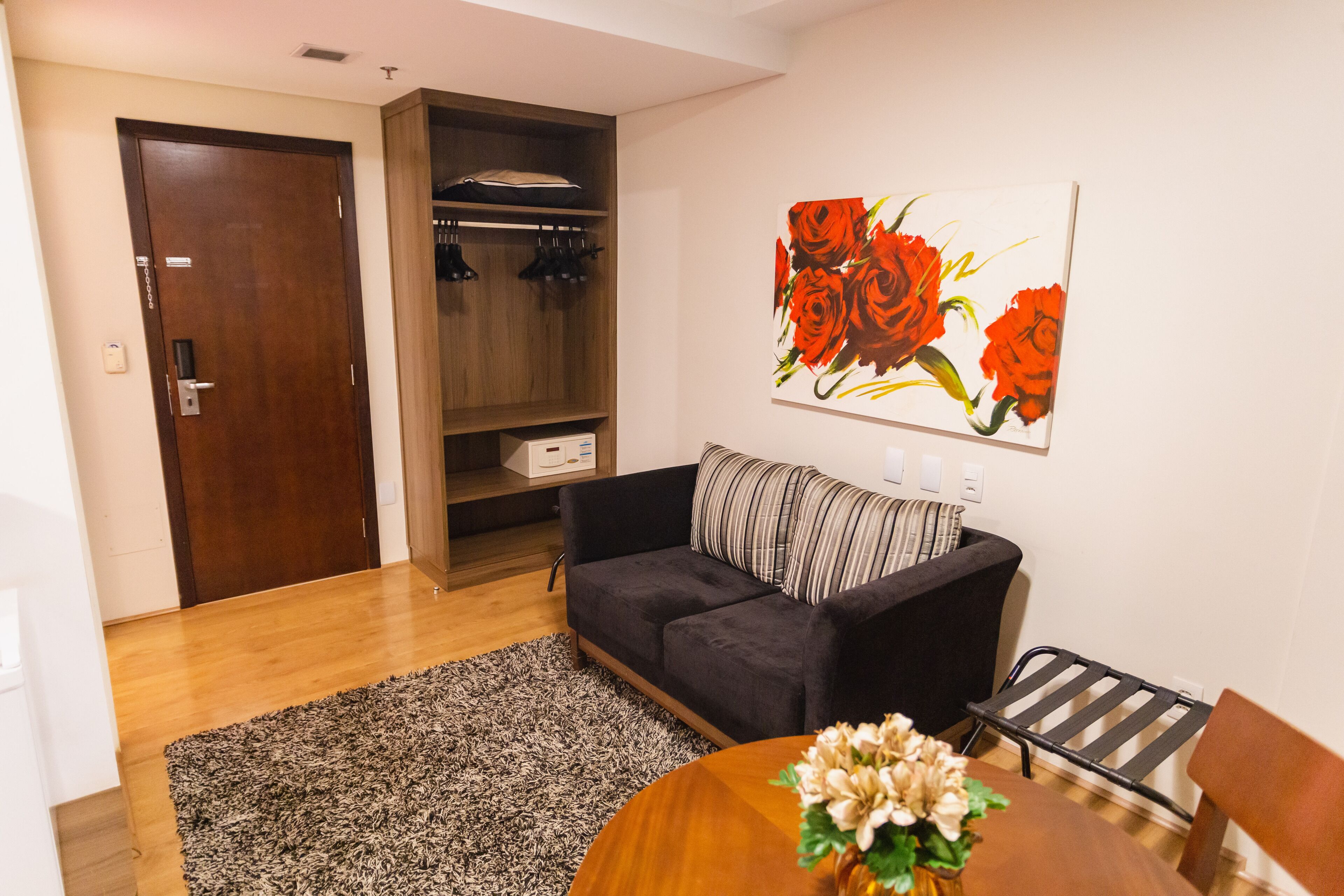 Premium Suite, 1 King Bed | Living area | 32-inch LCD TV with cable channels, TV
