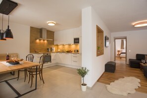 Family Apartment, 2 Bedrooms | Living area | Flat-screen TV, ping pong - Alpine Homes - Haus Haggenmüller (Hopfgarten im Brixental)