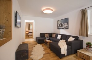 Family Apartment, 2 Bedrooms | Living area | Flat-screen TV, table tennis - Alpine Homes - Haus Haggenmüller (Hopfgarten im Brixental)