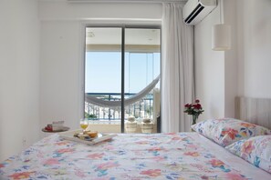 Apartment, 2 Bedrooms, Sea View | Individually decorated, blackout drapes, iron/ironing board, free WiFi