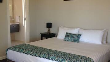 Premium bedding, blackout curtains, iron/ironing board