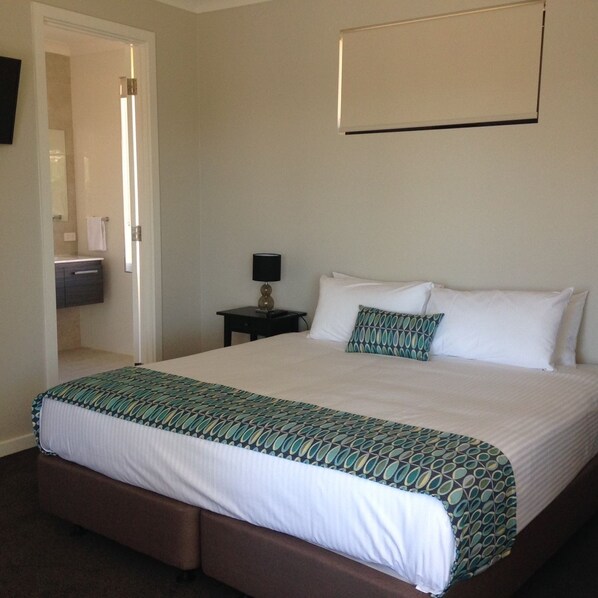 Premium bedding, blackout curtains, iron/ironing board