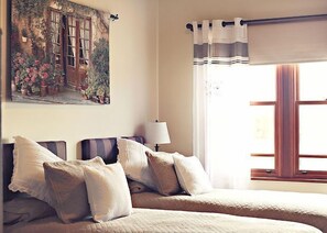 2 bedrooms, pillow-top beds, blackout curtains, rollaway beds